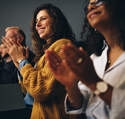 A row of people clapping