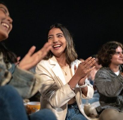 Happy young audience members