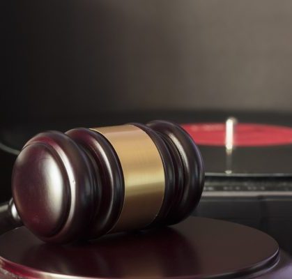Judge's gavel and vinyl record player